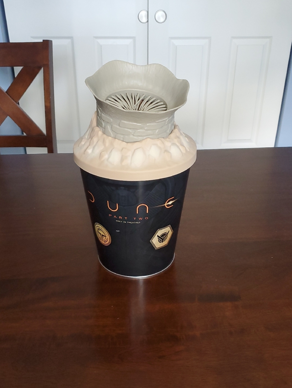 Dune 2 Popcorn Bucket. Zinc Metallic Silver Tin Lid with Brown Wood Surface
